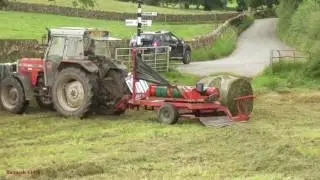 Baling with New Holland.  Wrapping with Massey.