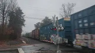 NS AC44C6M 4597 leads NS 13R w/ Rare white train car.
