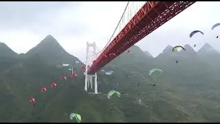 Skydivers Jump from 370-meter-high Bridge in Southwest China