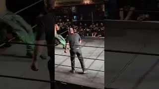 Myron Reed hits a cutter on Joey Janela to the outside of the ring. (Game Changer Wrestling)