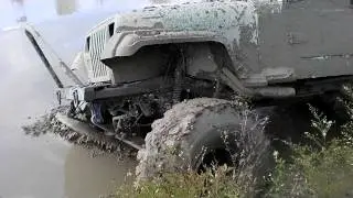 Green Jeep Mud Bogging