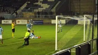 RUGBY'S KYLE ROWLEY DEFLECTS A LOW RUSHDEN CENTRE WIDE OF HIS OWN GOAL