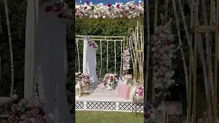 This outdoor nikkah setup features soft pastel tones accented with a vibrant pop of hot pink 🩷