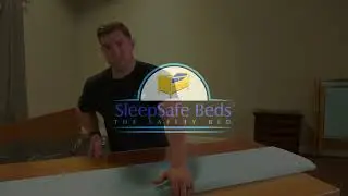 Installing pads to the side panels on the SleepSafe II Medium Bed.