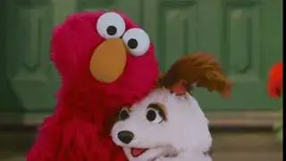 ELMO LOVES HIS DOGGIE