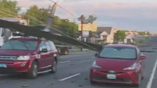 Storm knocks down power poles trapping motorists | FOX 5 News