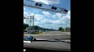 Csx crossing @ bryan dairy rr crossing  train  heading  backwards  towards  Clearwater  2 cars