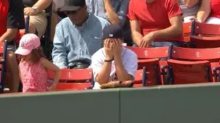 Young fan accidentally picks up fair ball