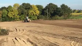 TOOMEY 3500B Scraper and Challenger levelling a shed pad in France.