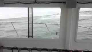 Broadside wave on dive boat.