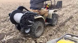 Four wheeler mounted fence winder