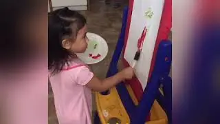 Hand and eye coordination activity of a 2 year old