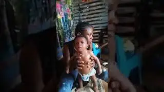 African way of feeding a baby