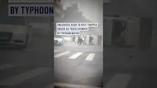 Heroic rescue: Onlookers pull driver from overturned truck in typhoon Matmo