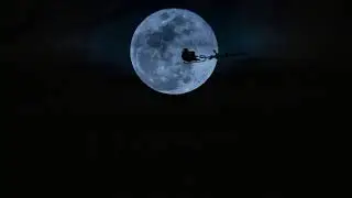 Santa flying over the moon