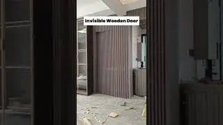 This wood slat wall hides a fully functional door.