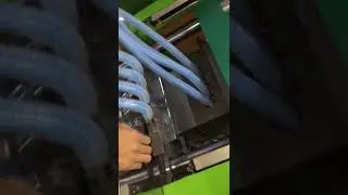 Injection molding of corrugated pipe joints, applied to vacuum cleaner accessories.