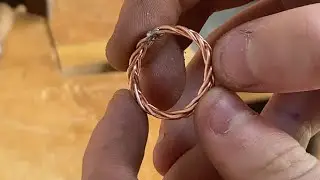 Creating a braided copper ring with 5 strands of copper wire.