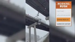First responders rescue a driver dangling off a highway bridge