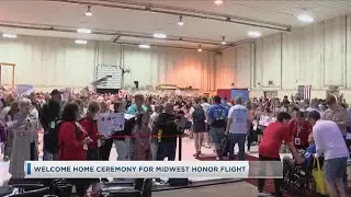 Crowd of Siouxlanders turn out for Midwest Honor Flight's welcome home ceremony in Sioux City