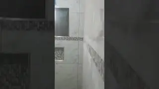 Transforming Bathroom With White Tiles And Mosaic Borders #bathroom #whitetiles #mosaicborders