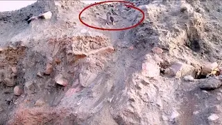 Digging in the Sand on a Red Cliff..