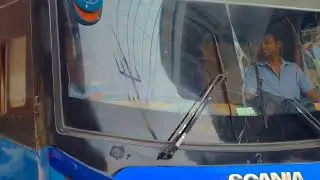 The National Travels bi-axle AC bus gently swaying it moves toward its destination || Luxury AC Bus
