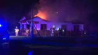 Firefighters put out flames seen coming through roof of Spencer home