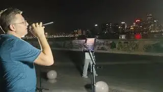 Street performance by Uzbek amateur singer of  Hotel California song,  as made famous by Eagles. 