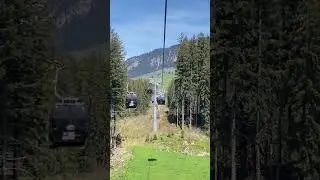 Titlis cable cars from Engelberg to Trubsee in Swiss Alps, display flags of countries!