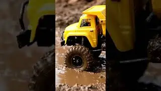 Low-Angle RC Dump Truck Backing Into Mud Pit | Taillight Reflection Shot