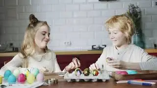 Free Footages | Life Style |   Two Kids Bumping Their Easter Egg Against Each Other