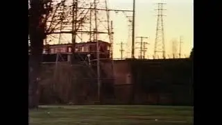 Harris train on the Epping line going over Merri Parade bridge Northcote in 1976.