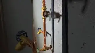 Pressure regulating valve located next to main water shutoff and calibrated to the expansion tank.