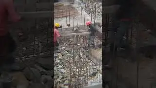 Workers using heavy tool to level subbase stones #workers #work #tools #equipment #level #build