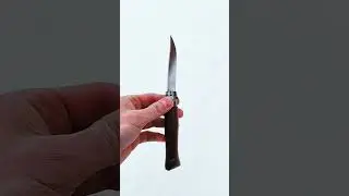 Opinel 9 w drewnie orzechowym w zimowej scenerii