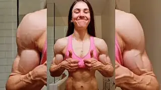 Beautiful muscular woman flexing muscles 