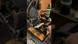 Using a printing press to print a phrase about having the freedom of the press
