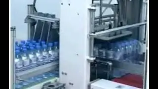 Shrink wrap machine for bottled water packaging with PE film.wmv