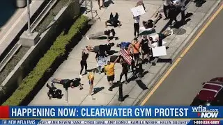 Gym protesters do squats and push-ups outside courthouse