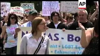 Holding signs and chanting 