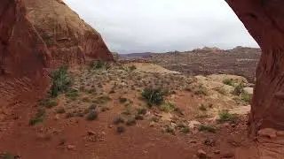 Stock Video - Drone flying through Funnel Arch in Moab