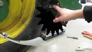 Installing the Thompson closing wheels, medium closing spring and toe-out wedges on a planter