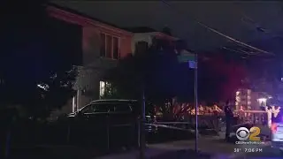 Person of interest in custody in Queens triple murder