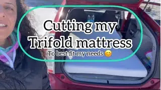 Cutting my trifold mattress to fit the Prius without having to move my front seats.