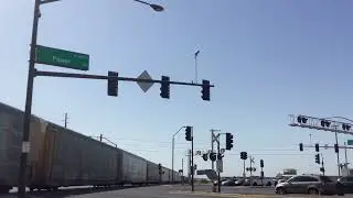 Train passes Power and Pecos Rd with a horn salute and car almost gets hit by the crossing gate