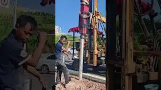 Guardrail pile driver on site construction