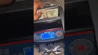 Money counter Counting over $1,000 dollars in twenties