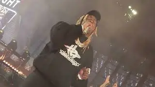 Lil Wayne performing at halftime of  the Raiders and Steelers game
