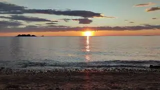Peaceful sunset with gentle waves and birds, Rovinj, Adriatic sea, Croatia 